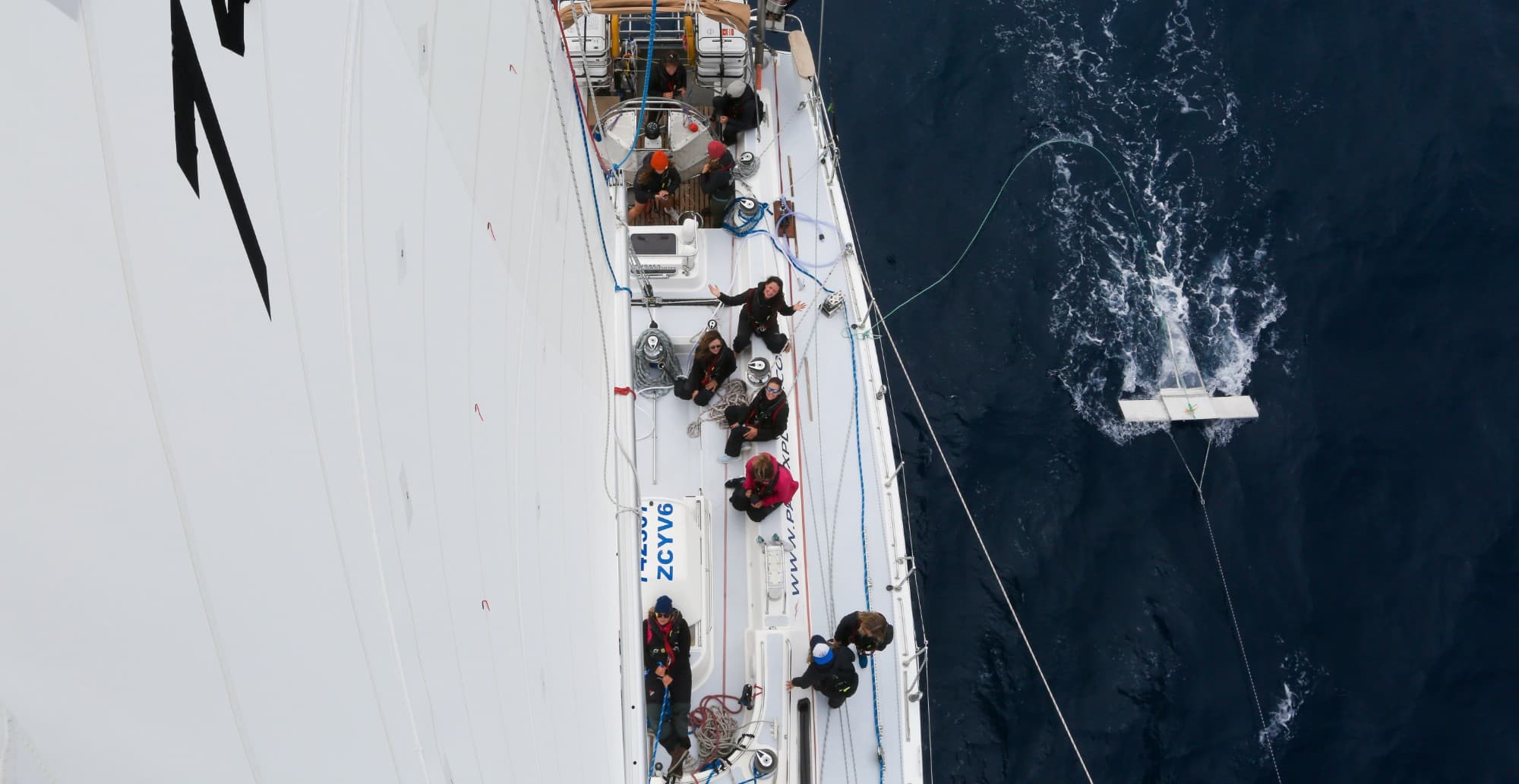 Aerial view of the crew on deck towing a manta trawl